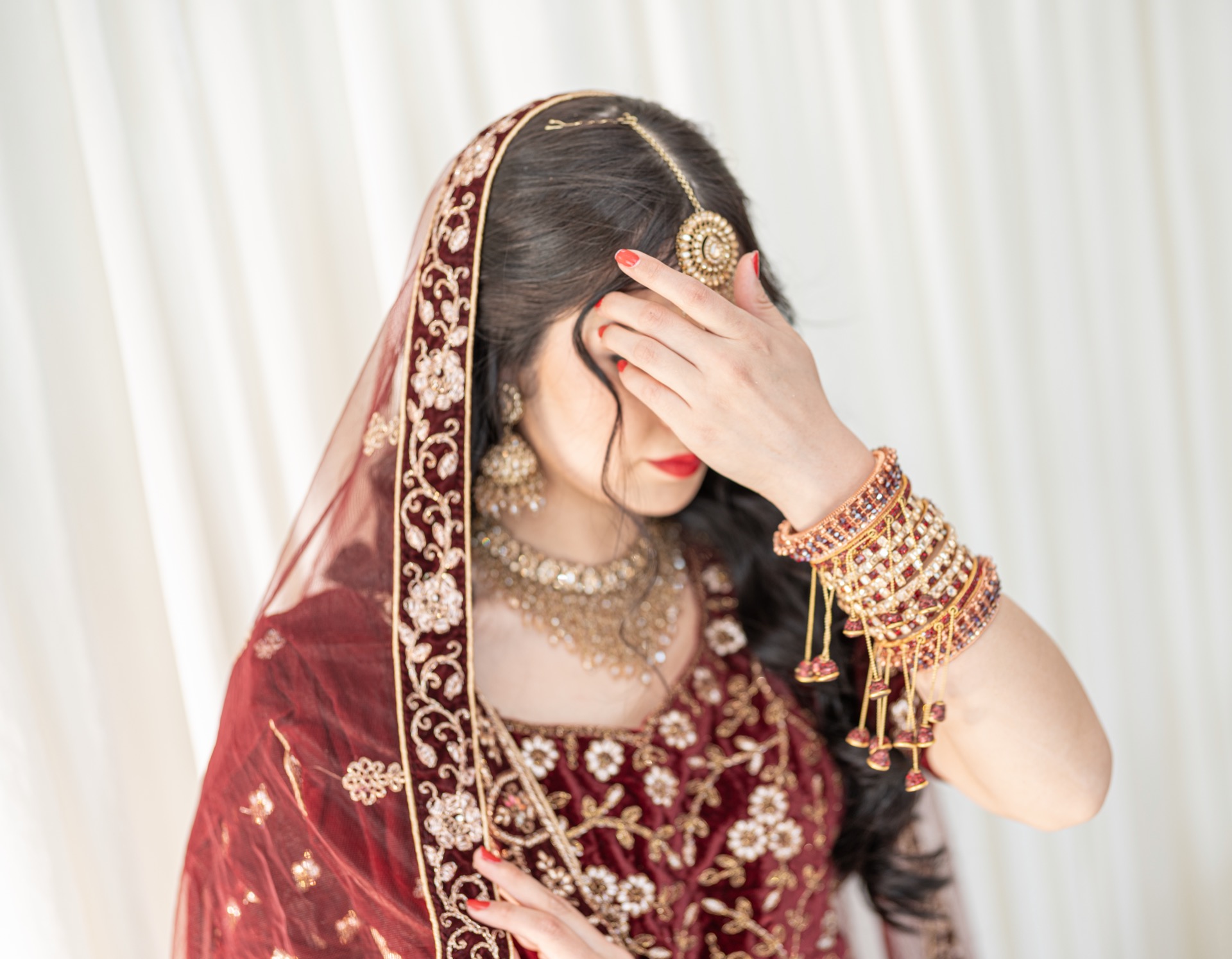 A woman wearing a traditional afghan dress.