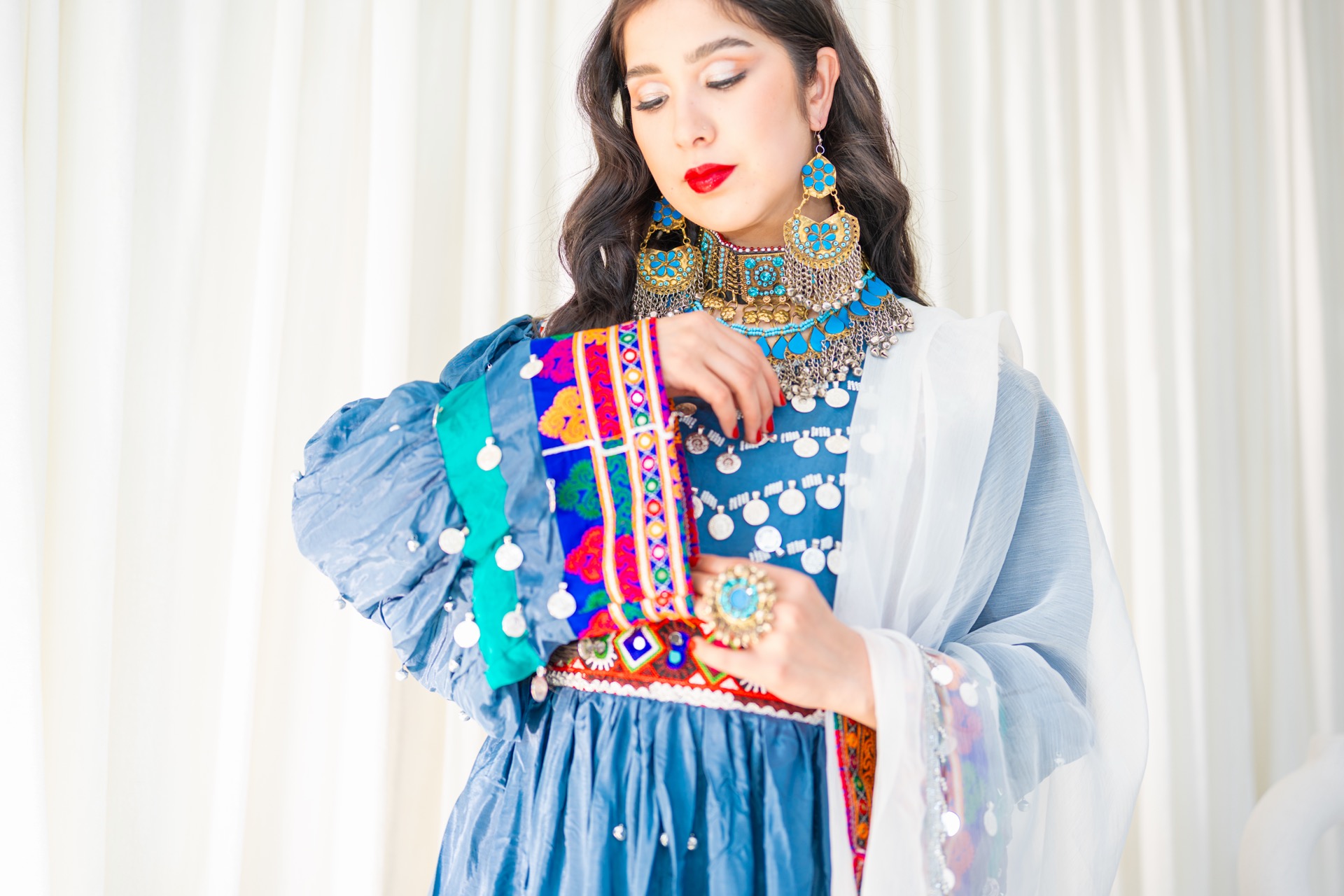 A woman wearing a traditional afghan dress.