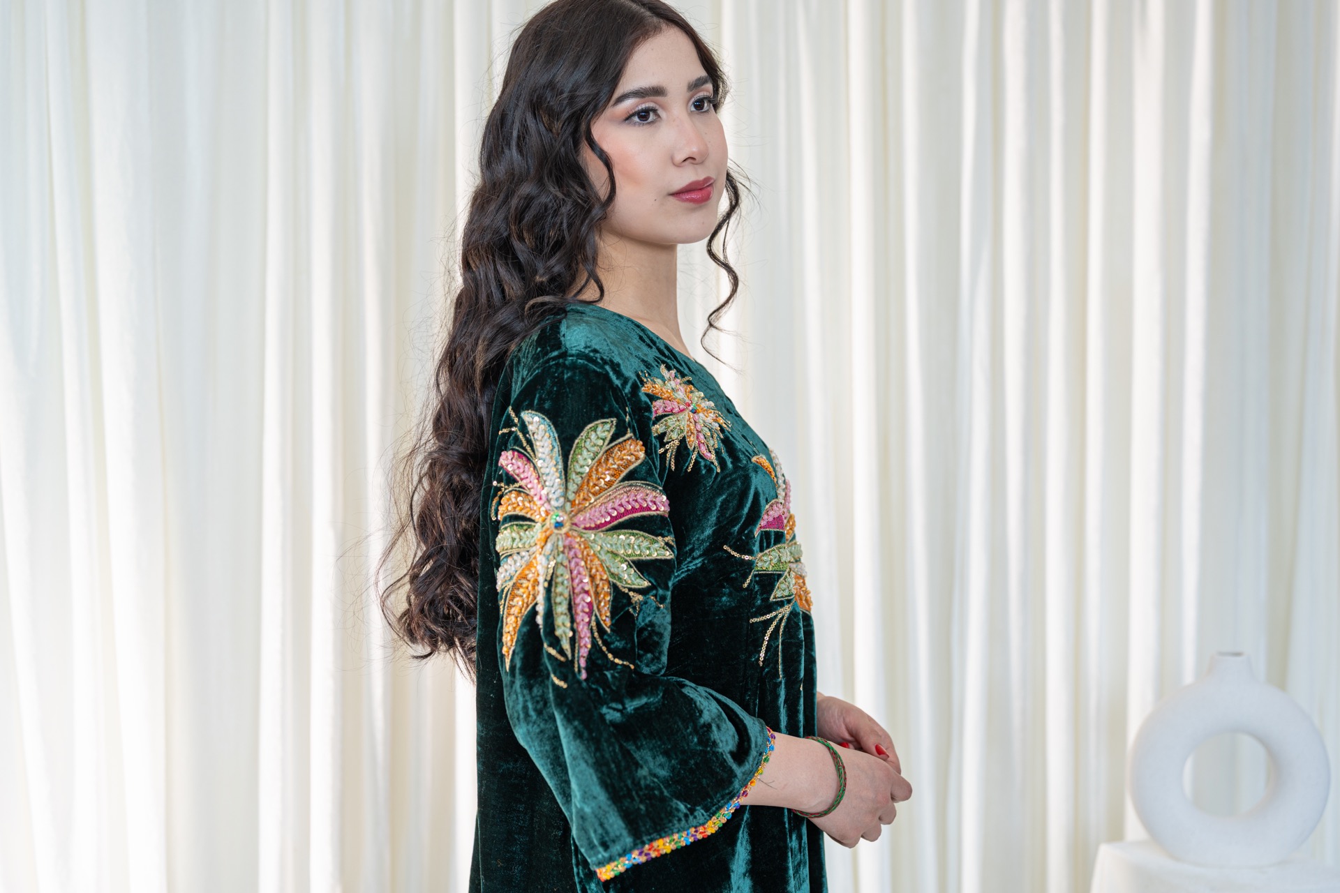 A woman wearing a traditional afghan dress.