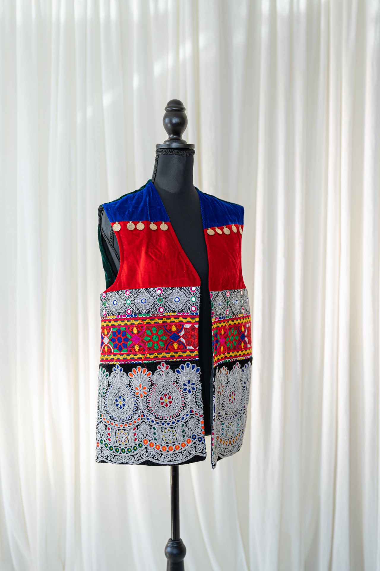 A woman wearing a traditional afghan dress.