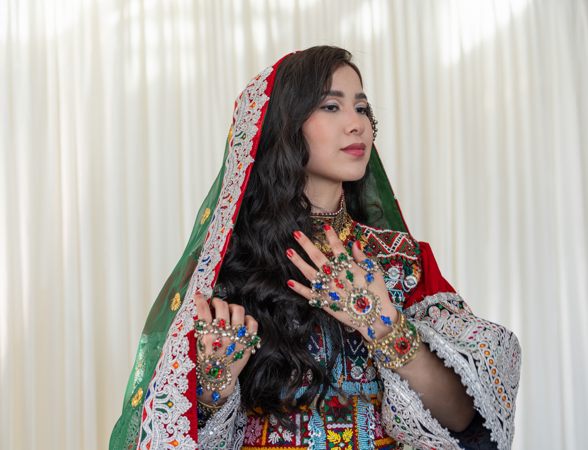 A woman wearing a traditional afghan dress.